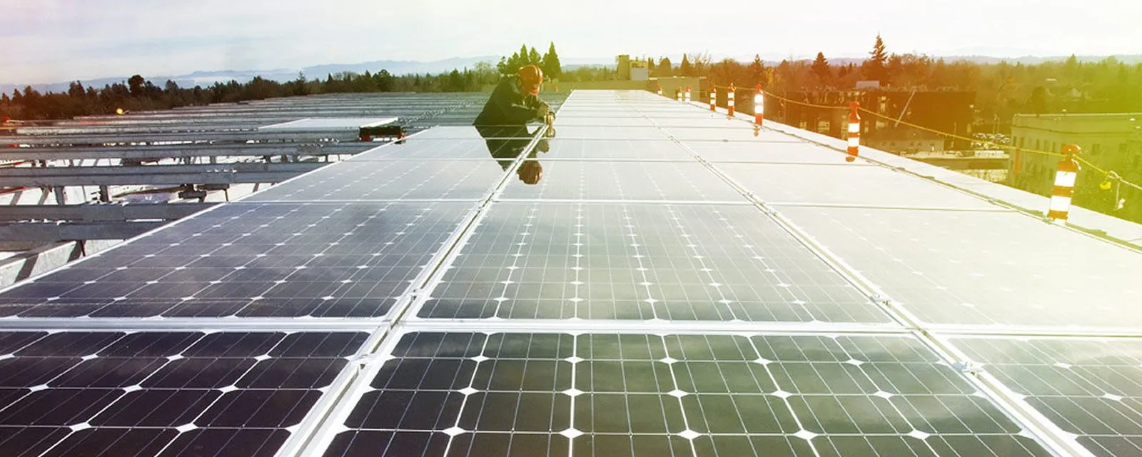 Technician inspecting a rooftop solar plant